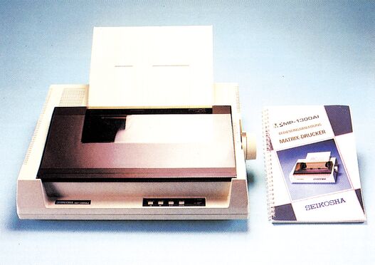 Seikosha MP-1300 AI Drucker mit Handbuch daneben